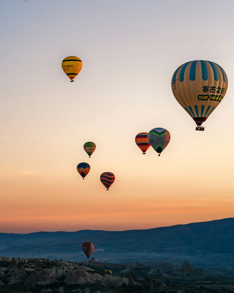 Hot air balloons over Cappadocia at sunrise